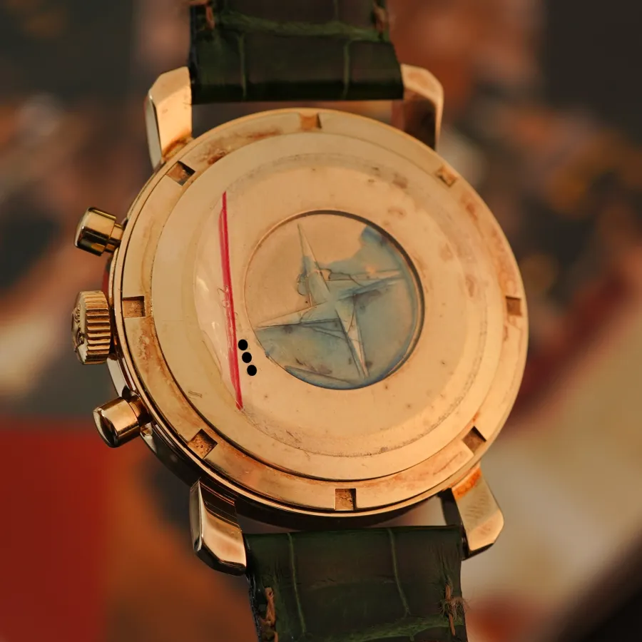 Movado-Zenith El Primero Gold - screw-down caseback with intact serial number and remnants of the original sticker