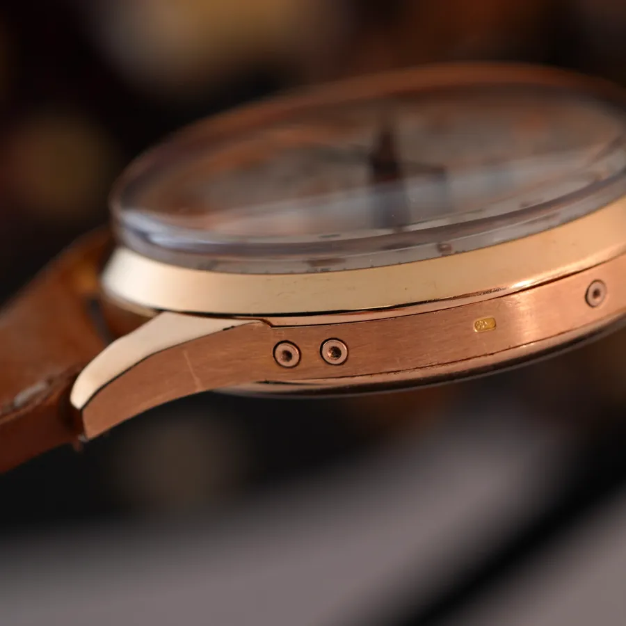 Universal Genève Tri-Compax 12285 Full Calendar Pink Gold - deep gold hallmark and the buttons to adjust the calendar