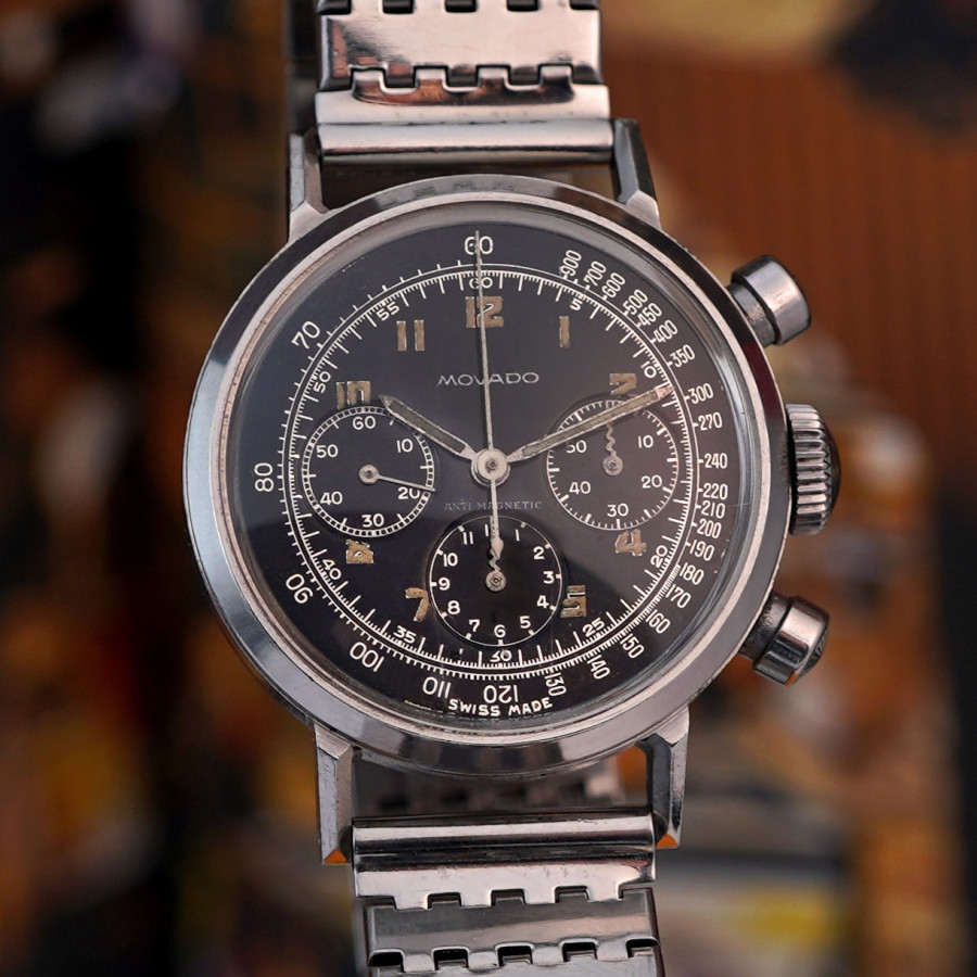 Movado M95 Chronograph 19018 Black Dial - kontrastreicher silberfarbener Druck, originale Leuchtmasse